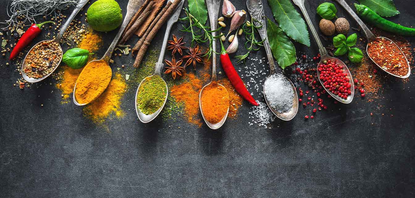 Spoons full of colorful spices